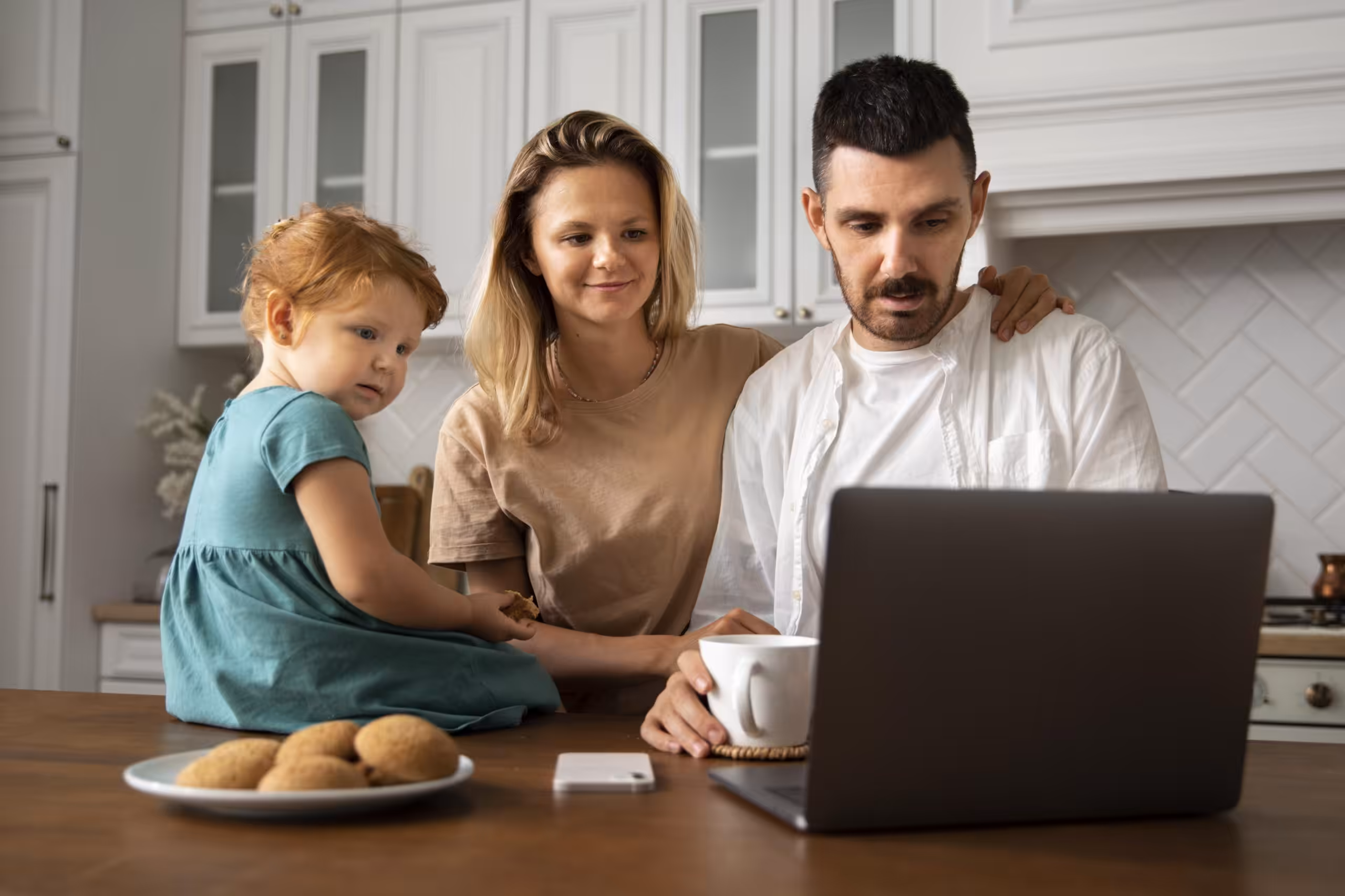 Family reviewing home loan options on laptop